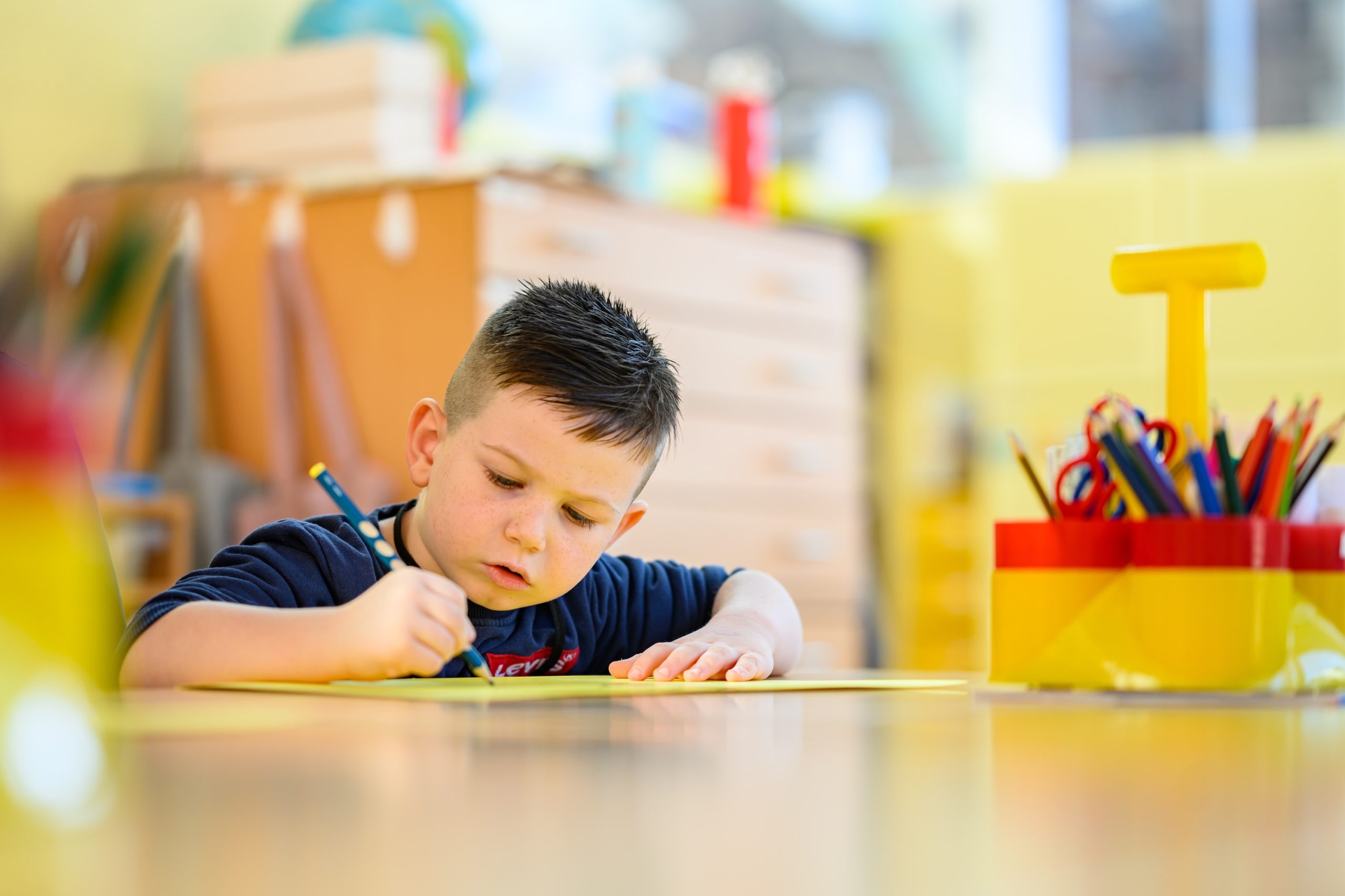 Evelina School Header image showing child writing or drawing
